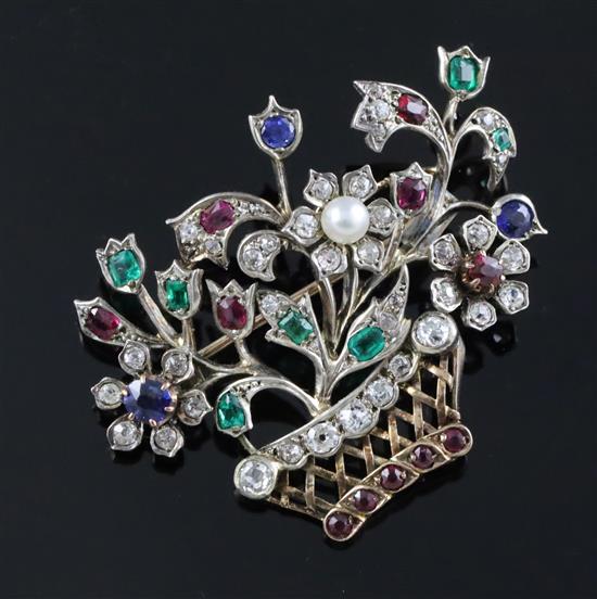 An early 20th century gold and multi gem set guiardinetto (flowers in a basket) brooch, gross 9.9 grams.